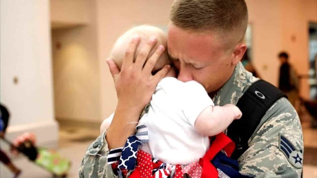 The emotional moment of being reunited with the soldier’s newborn child 