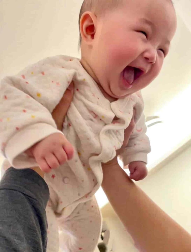 Heartwarming moment: A baby’s laughter brings joy to a mother’s soul. 