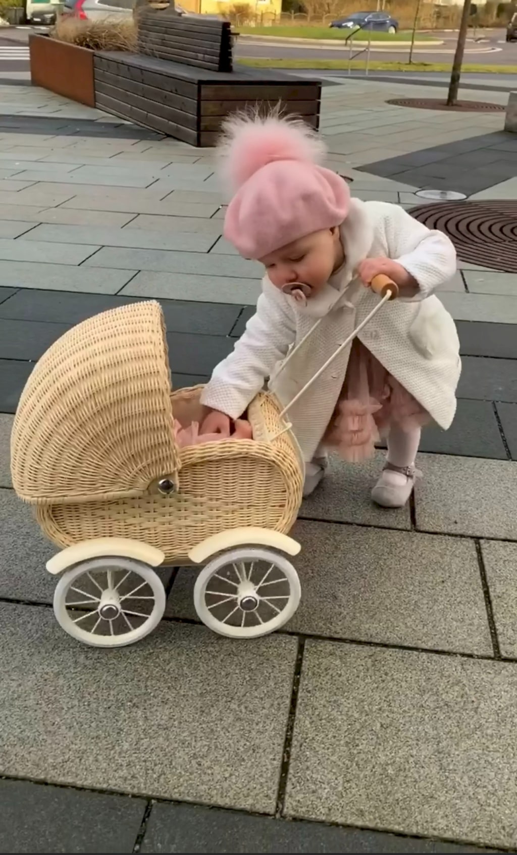 Funny and adorable pictures of baby pushing his doll stroller