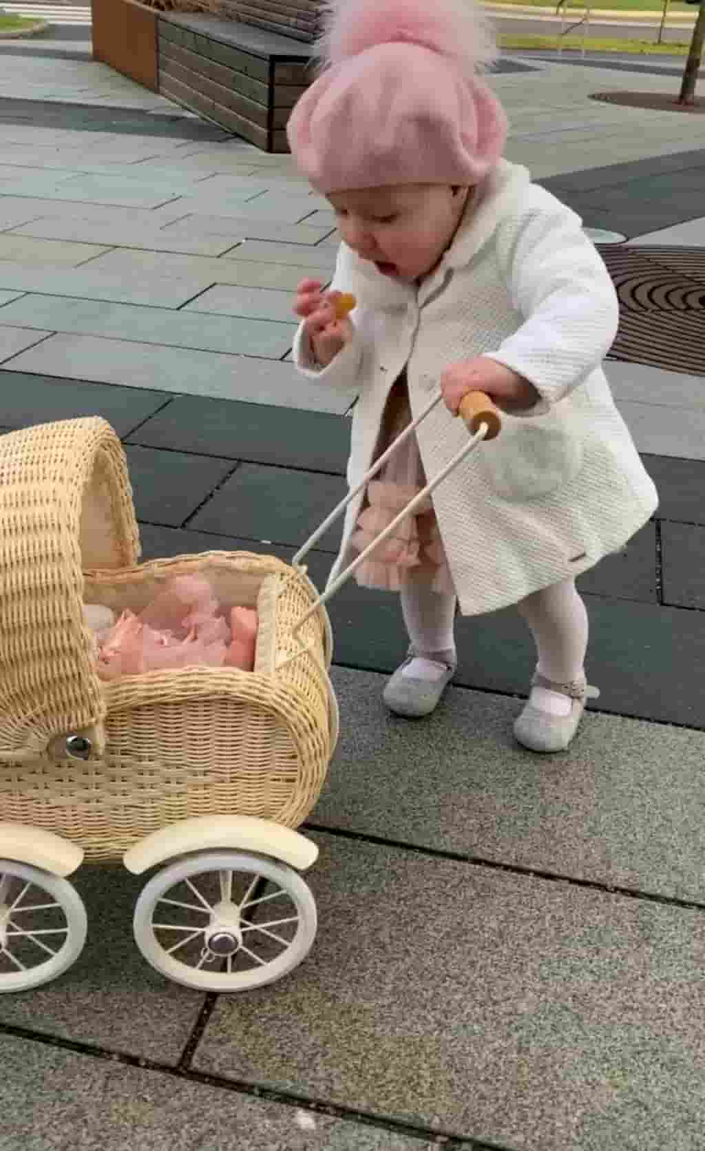 Funny and adorable pictures of baby pushing his doll stroller