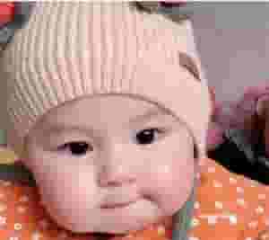 QL Heartwarming Scene: Young girl with rosy cheeks enjoying cake ‎